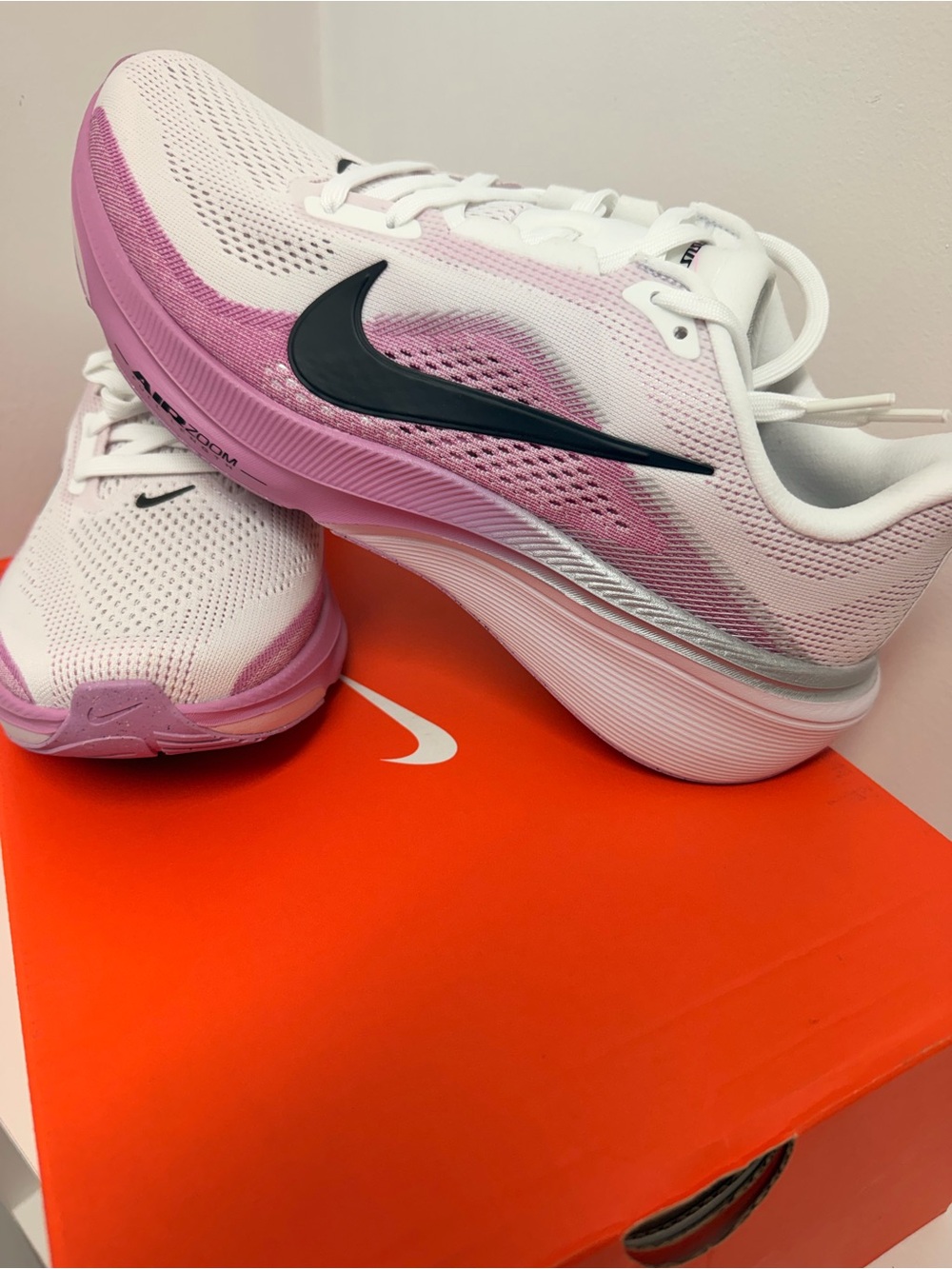 Nike Women’s White and Pink Athletic Running Shoes with Black Swoosh